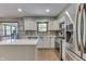 Bright kitchen with stainless steel appliances, white cabinetry, and a large sink with window at 1480 E Jefferson St, Franklin, IN 46131