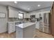 Modern kitchen featuring stainless steel appliances, center island, and quartz countertops at 1480 E Jefferson St, Franklin, IN 46131