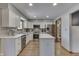 Bright kitchen with white cabinetry, stainless steel appliances, and a central island at 1480 E Jefferson St, Franklin, IN 46131