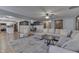 Bright, open living room featuring a comfortable sectional sofa and open access to the dining room at 1480 E Jefferson St, Franklin, IN 46131