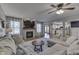 Bright and open living room featuring a fireplace, large sectional sofa, and an open view to the kitchen at 1480 E Jefferson St, Franklin, IN 46131