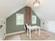 Bright room featuring a brick chimney and two windows at 1502 Burdsal Pkwy, Indianapolis, IN 46208