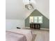 Bedroom with a bed and a dresser with decor and lamps at 1502 Burdsal Pkwy, Indianapolis, IN 46208