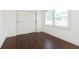 Cozy bedroom featuring a closet with sliding doors and a window at 1502 Burdsal Pkwy, Indianapolis, IN 46208