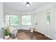 Inviting entryway with hardwood floors, decorative rug, and ample natural light, creating a warm welcome at 1502 Burdsal Pkwy, Indianapolis, IN 46208