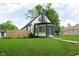 Charming home showcasing its manicured lawn, inviting curb appeal, and well-maintained exterior at 1502 Burdsal Pkwy, Indianapolis, IN 46208