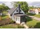 Lovely home with a dark roof, well-manicured lawn, and a charming front entrance at 1502 Burdsal Pkwy, Indianapolis, IN 46208