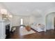 Bright living room with fireplace, hardwood floors, comfortable couch, and neutral decor at 1502 Burdsal Pkwy, Indianapolis, IN 46208