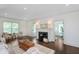 Bright living room with fireplace, hardwood floors, natural light, and neutral decor at 1502 Burdsal Pkwy, Indianapolis, IN 46208