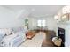 Bright living room with a fireplace, neutral-toned furniture, and hardwood floors, creating a cozy space at 1502 Burdsal Pkwy, Indianapolis, IN 46208