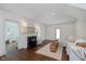 Bright living room featuring a fireplace, dark hardwood floors, and a comfortable couch at 1502 Burdsal Pkwy, Indianapolis, IN 46208