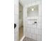 Elegant tiled shower with a decorative niche and accent lighting, complemented by a stylish overhead fixture at 1502 Burdsal Pkwy, Indianapolis, IN 46208