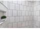 Bathroom shower featuring white subway tile and a built-in niche at 1502 Burdsal Pkwy, Indianapolis, IN 46208