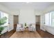 Bright sunroom with two chairs, french doors, and natural light at 1502 Burdsal Pkwy, Indianapolis, IN 46208