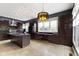 Large kitchen with island, stainless appliances, granite countertops, and custom cabinets at 1526 Carrollton Ave, Indianapolis, IN 46202