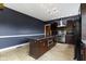 Kitchen with large island, stainless appliances, granite countertops, and custom cabinets at 1526 Carrollton Ave, Indianapolis, IN 46202