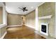 Spacious living room showcasing hardwood floors, fireplace, and ample natural light, perfect for entertaining and relaxation at 1526 Carrollton Ave, Indianapolis, IN 46202