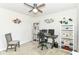 Bedroom featuring a ceiling fan, neutral paint, built in shelving, and decor on the walls at 1530 Gristmill Meadows Dr, Westfield, IN 46074