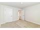 This is a spacious bedroom with neutral carpet, white walls and two large doors at 1530 Gristmill Meadows Dr, Westfield, IN 46074