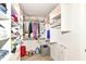 A spacious walk-in closet with white custom shelving and ample storage space for clothes, shoes, and accessories at 1530 Gristmill Meadows Dr, Westfield, IN 46074