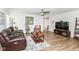 Inviting living room with wood floors, a ceiling fan, and contemporary decor at 1530 Gristmill Meadows Dr, Westfield, IN 46074