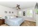 Serene bedroom featuring a ceiling fan, carpeted floors, and natural light from the windows at 1530 Gristmill Meadows Dr, Westfield, IN 46074