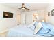 Comfortable bedroom showcasing a ceiling fan, carpeted floors, and an attached bathroom at 1530 Gristmill Meadows Dr, Westfield, IN 46074