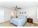 Cozy bedroom with a ceiling fan, plush carpeting, and an ensuite bathroom at 1530 Gristmill Meadows Dr, Westfield, IN 46074