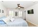 Relaxing bedroom with a ceiling fan, plush carpet, and a view of the ensuite bathroom at 1530 Gristmill Meadows Dr, Westfield, IN 46074