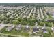 Aerial view of a neighborhood featuring well-maintained homes and green spaces at 1595 N Blue Rd, Greenfield, IN 46140