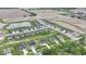 Scenic aerial view of a community with a pond, green spaces, and well-designed homes at 1595 N Blue Rd, Greenfield, IN 46140