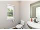 Powder room featuring neutral walls, bright window, pedestal sink, and modern fixtures at 1595 N Blue Rd, Greenfield, IN 46140