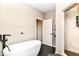 Bathroom with free-standing tub and walk-in shower featuring tile surround at 1595 N Blue Rd, Greenfield, IN 46140