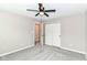 Comfortable bedroom featuring soft carpet and an open closet, plus a modern ceiling fan at 1595 N Blue Rd, Greenfield, IN 46140