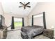 Bedroom with vaulted ceiling, fan, and window letting in natural light at 1595 N Blue Rd, Greenfield, IN 46140