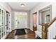 Bright foyer features hardwood floors, French doors, and natural light at 1595 N Blue Rd, Greenfield, IN 46140