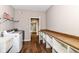 Spacious laundry room includes washer, dryer, and shelving for storage at 1595 N Blue Rd, Greenfield, IN 46140