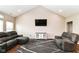 Comfortable living room features vaulted ceilings, plush seating, and neutral tones at 1595 N Blue Rd, Greenfield, IN 46140