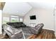 Spacious living room with high ceilings, recessed lighting, and plush seating at 1595 N Blue Rd, Greenfield, IN 46140