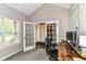 Bright office features grey carpet, natural light, and French doors at 1595 N Blue Rd, Greenfield, IN 46140