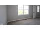 Standard bedroom with neutral carpeting, light gray walls, and a window letting in natural light at 16835 Cheddar Dr, Noblesville, IN 46060