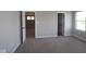 Carpeted bedroom with two doors and a window at 16835 Cheddar Dr, Noblesville, IN 46060