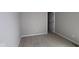 Standard bedroom with neutral carpeting, light gray walls, and a door to the closet at 16835 Cheddar Dr, Noblesville, IN 46060