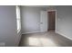 Standard bedroom with neutral carpeting, light gray walls, and a window letting in natural light at 16835 Cheddar Dr, Noblesville, IN 46060