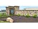 Stone entrance sign for Silo Ridge featuring professional landscaping with plants and mulch at 16835 Cheddar Dr, Noblesville, IN 46060