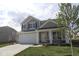 Charming two-story home with a large two-car garage and craftsman-style details at 16835 Cheddar Dr, Noblesville, IN 46060