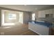 Bright kitchen featuring an island with a sink, white cabinets, and modern design at 16835 Cheddar Dr, Noblesville, IN 46060