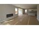 Bright living room featuring a fireplace and large windows at 16835 Cheddar Dr, Noblesville, IN 46060