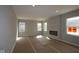 Bright living room featuring a fireplace and large windows at 16835 Cheddar Dr, Noblesville, IN 46060