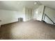 Attic space with white walls, carpet flooring, neutral accents, and storage space at 1739 Crystal St, Anderson, IN 46012